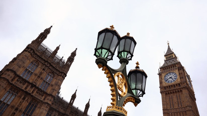 UK business office scene depicting staff layoffs and economic slowdown trends, reflecting Novembers PMI data insights.