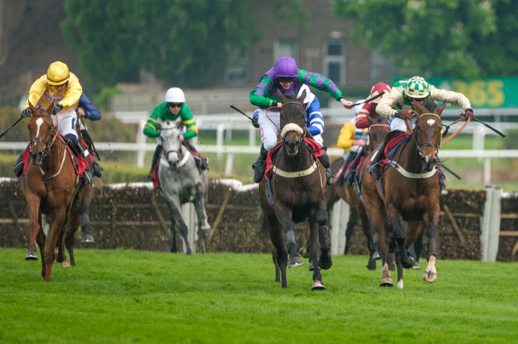 GettyImages 2212078031 showing a diverse group of professionals in a modern office discussing business strategy and collab...