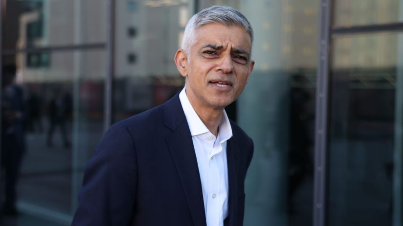 GettyImages 2237599229 depicts a professional business meeting with diverse team members collaborating in a modern office ...