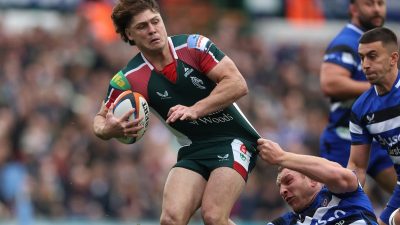 Breaking news scene with journalists, microphones, and cameras capturing a press conference at Getty Images headquarters.