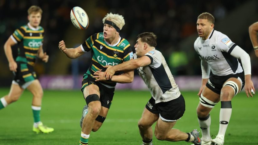 Breaking news event with gathered journalists, press conference setting, microphones, and media personnel in a business en...