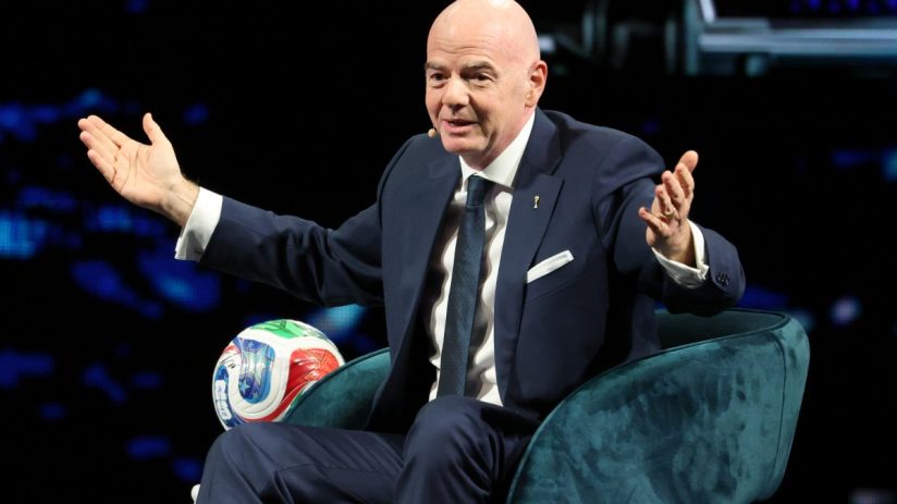 GettyImages 2245218789 features a business meeting with diverse professionals discussing financial reports and strategies.