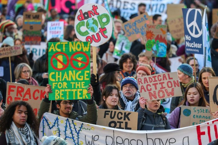 Breaking news coverage with business professionals discussing economic trends in a modern conference room setting