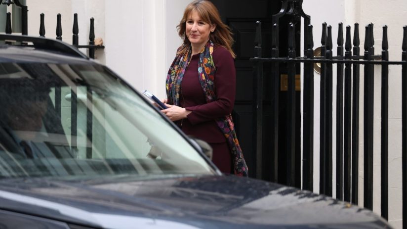 GettyImages 2246865977 showing a business professional in an office setting, engaged in a meeting or presentation.