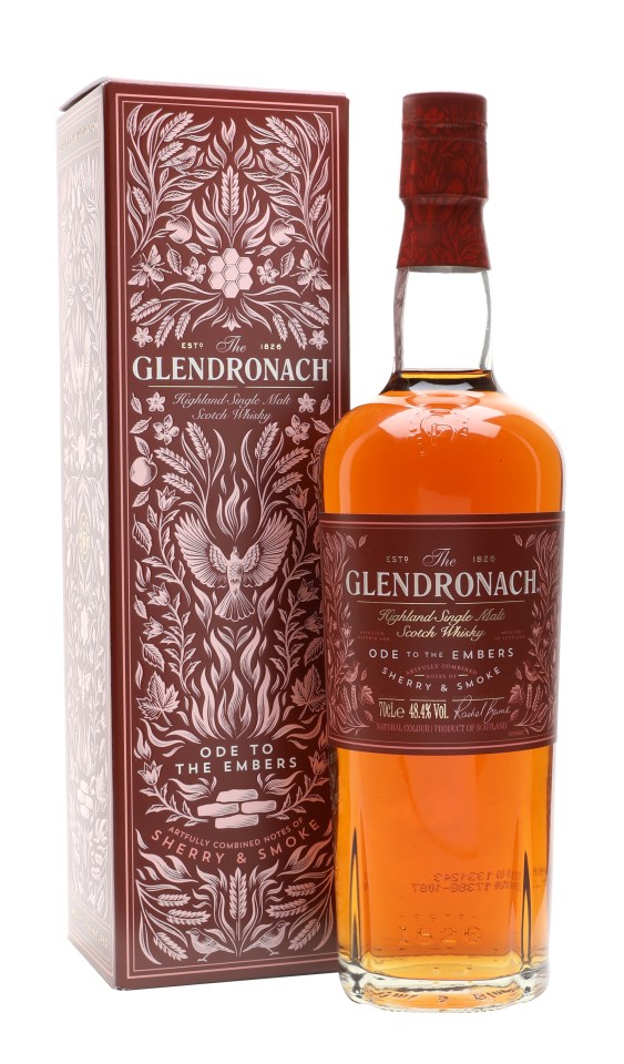 Glendronach Ode to the Embers whiskey bottle with rich amber color and elegant label design, set against a rustic wooden b...