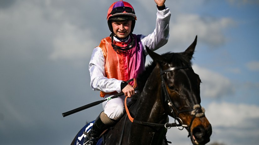 Vibrant street scene in Haiti showcasing colorful local art and bustling market activity under clear blue skies