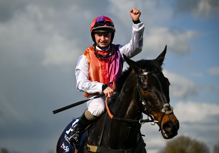 Vibrant street scene in Haiti showcasing colorful local art and bustling market activity under clear blue skies