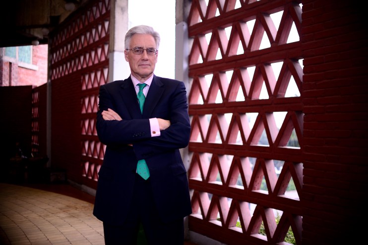 Lord Adair Turner speaking at a conference, focused on economic policy and financial regulation insights.