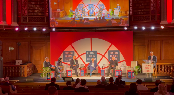 Business panel discussion highlighting opportunities for growth featuring four expert speakers at a corporate event.