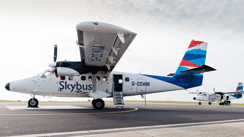 Skybus aircraft showcasing sleek design and modern technology against a clear sky in a business news context