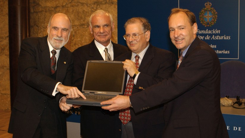 Tim Berners-Lee speaking at a tech conference, emphasizing the importance of internet accessibility and innovation.