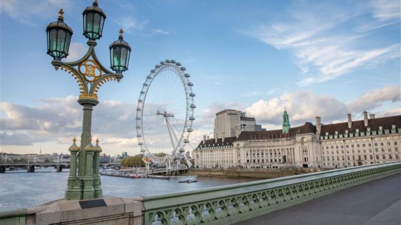 Tourists exploring city streets as new tourism tax policy impacts travel costs and local economies