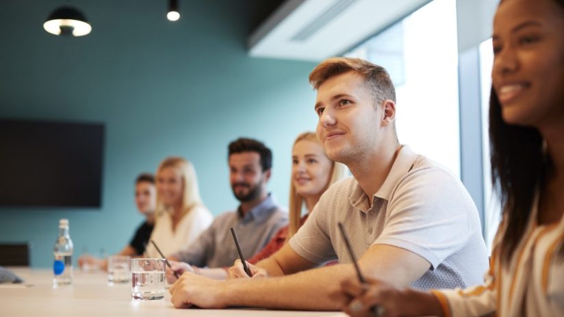 Young professionals collaborating in a modern office space, showcasing teamwork and innovation in a business environment.