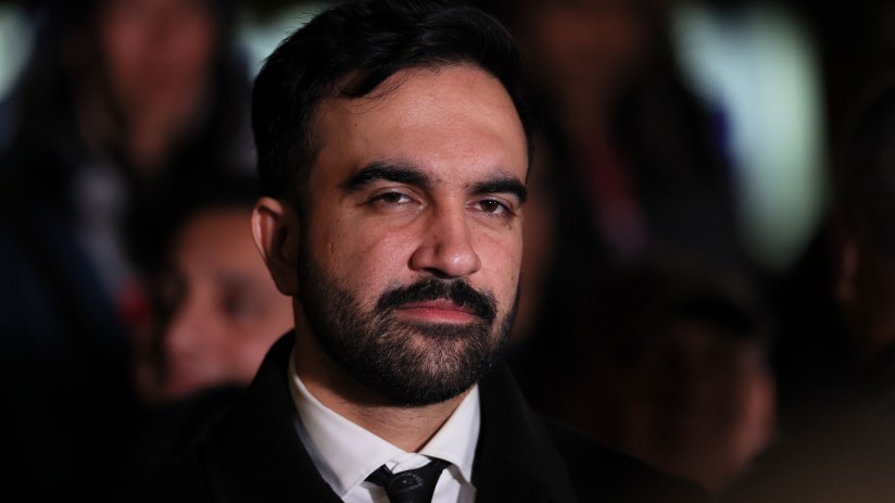 Zohran Mamdani speaking at a public event, addressing community issues and legislative initiatives in New York