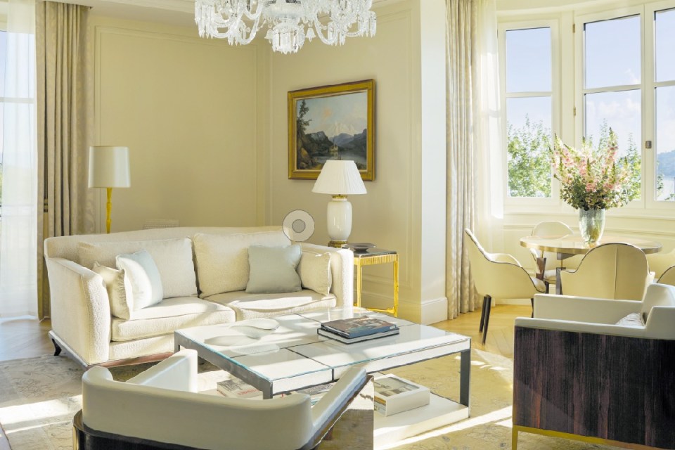 Scenic view of Geneva cityscape showcasing iconic landmarks and vibrant city life under a clear blue sky