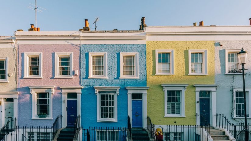 Modern residential house with contemporary architecture design in suburban neighborhood, showcasing large windows and land...
