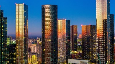 Manchester skyline with iconic landmarks during a Belfast speech event, highlighting urban landscape and architectural bea...