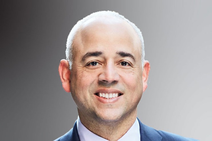 Jose Minaya presenting at a business event, engaging audience with innovative ideas and strategies, professional setting v...