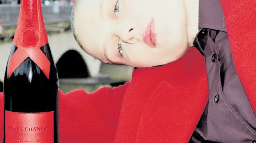 Moet champagne bottle with elegant packaging and golden accents, set against a refined background, highlighting luxury and...