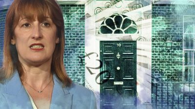 Rachel Reeves discussing tax policy design at a business conference, standing at podium with presentation slides in backgr...