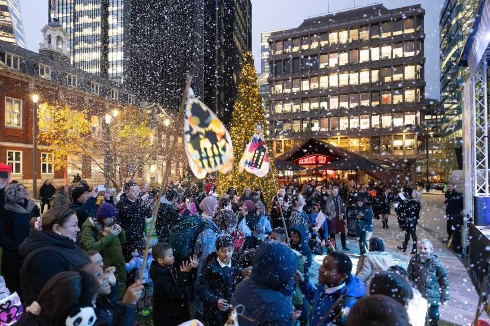 Mickey LF Lee at a business event, December 2024, wearing formal attire, engaging with the audience, medium-resolution image