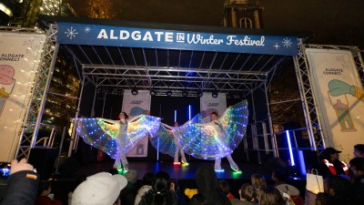 Mickey Lee at 2024 business conference, speaking on leadership and innovation, with audience engaged in discussion