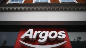 Argos storefront showcasing the latest product displays and promotional banners in a bustling city center location