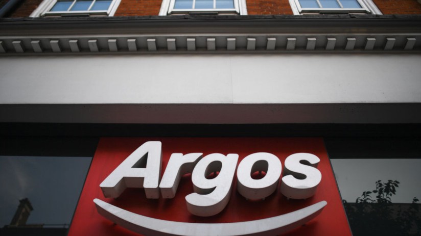 Argos storefront showcasing the latest product displays and promotional banners in a bustling city center location