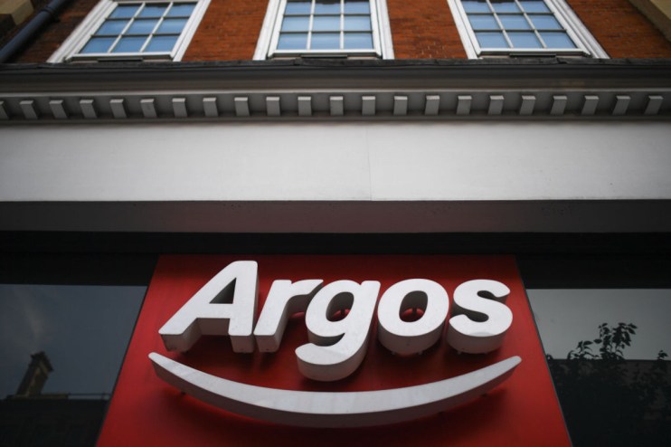 Argos storefront showcasing the latest product displays and promotional banners in a bustling city center location