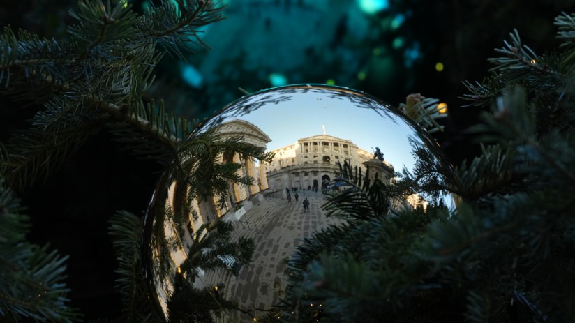 Bank of England building adorned with festive Christmas decorations during winter holiday season