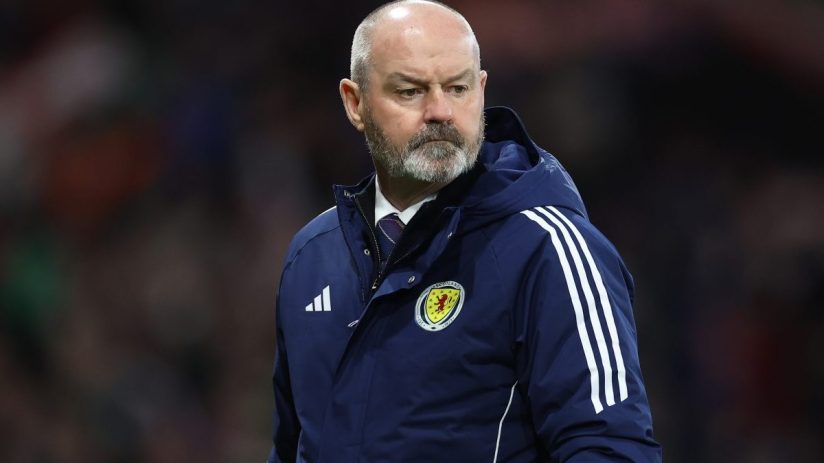 GettyImages 2118061469 features a business meeting in a modern office with diverse professionals discussing strategies and...