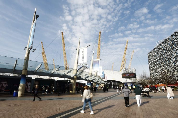 GettyImages 2200386037 showing a diverse group of business professionals in a modern office setting discussing strategic p...