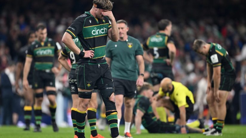 GettyImages 2216849423: Business professionals in a meeting, discussing strategic planning and analyzing financial data.