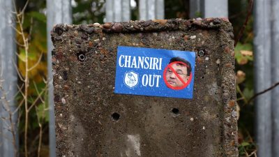 General news article image depicting a dynamic business scene, capturing professionals collaborating in a modern office se...