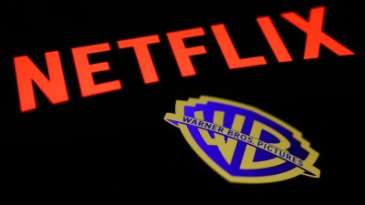 GettyImages 2250424721 shows a professional business meeting with diverse executives discussing strategies in a modern con...