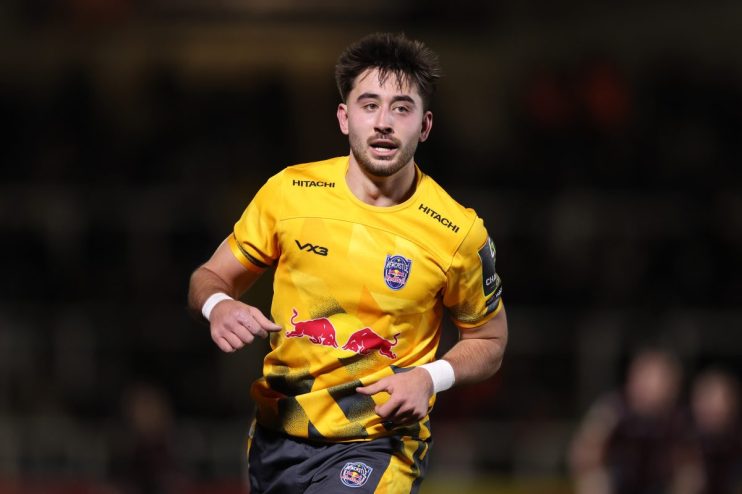 GettyImages 2251774786 shows a business meeting with diverse professionals discussing strategies in a modern conference room.