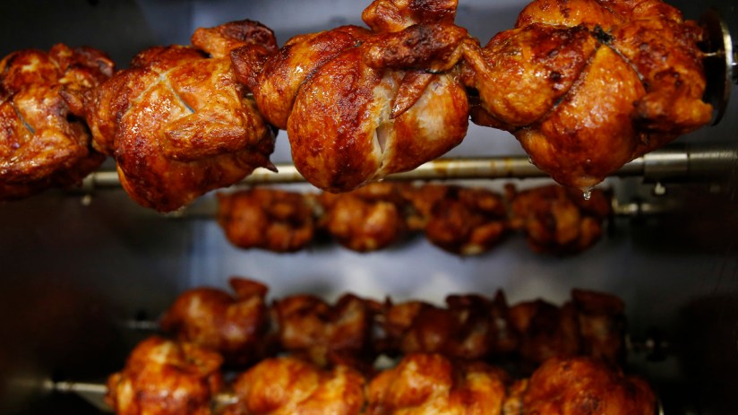 Getty Images business meeting in modern conference room with diverse professionals discussing strategies and reviewing doc...