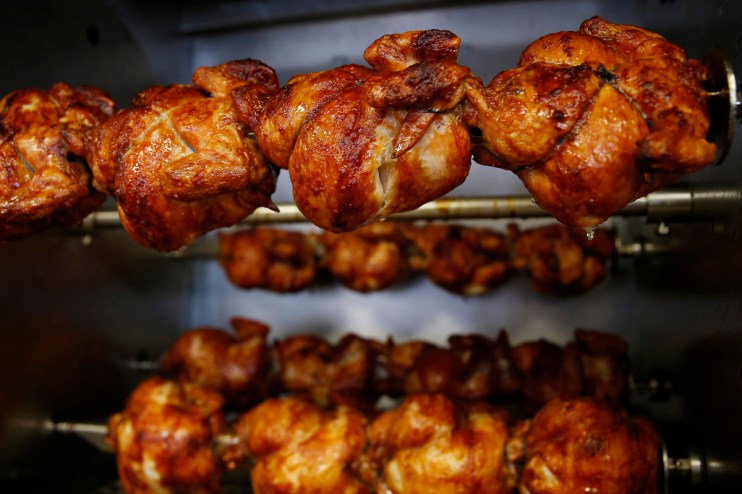 Getty Images business meeting in modern conference room with diverse professionals discussing strategies and reviewing doc...