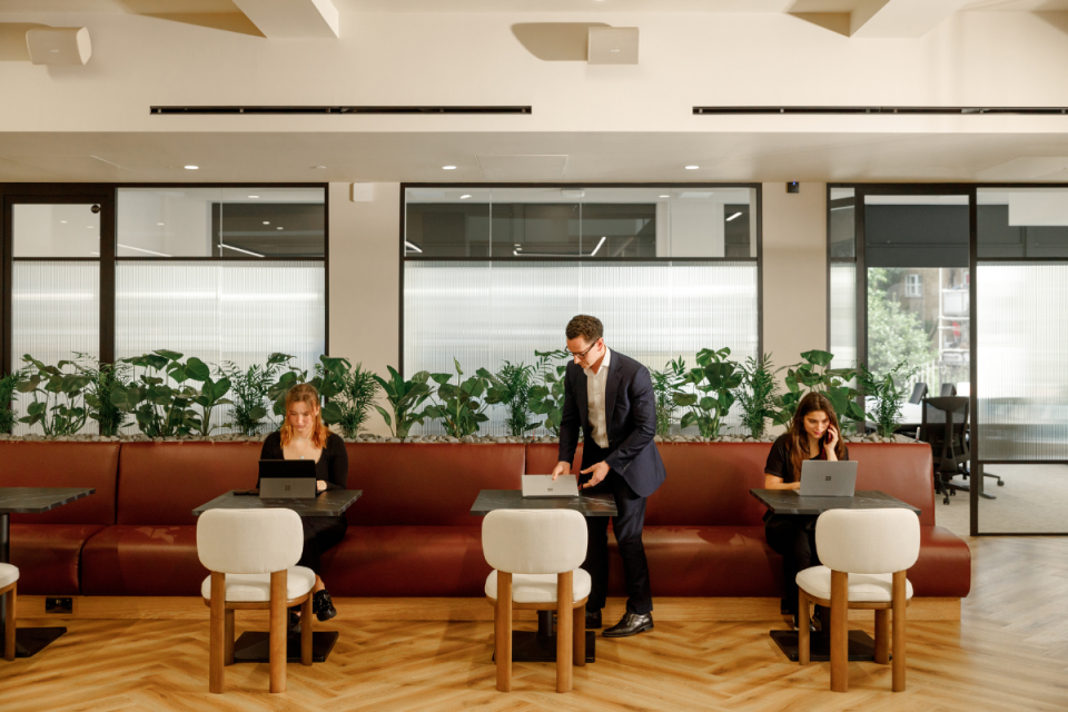 Halkin Choice headquarters exterior, modern architecture with glass facade, representing business innovation and growth