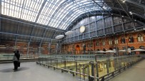 St Pancras International Station bustling with commuters and travelers, showcasing architectural grandeur and vibrant acti...