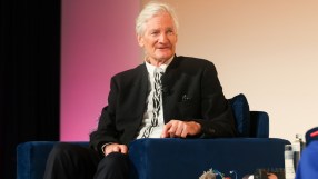 James Dyson discussing inheritance tax reforms at a business conference podium, emphasizing economic impacts.