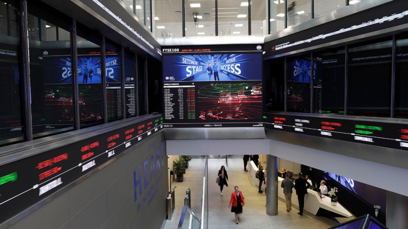 London Stock Exchange exterior bustling with traders and visitors, showcasing iconic architecture and vibrant financial ac...