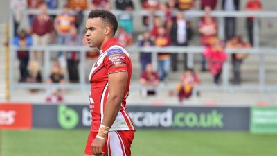 Mason Caton Brown in action on the field during a rugby match, showcasing agility and focus, wearing team jersey and gear.