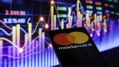 Mastercard logo prominently displayed on a sleek office building, symbolizing global financial services and innovation.