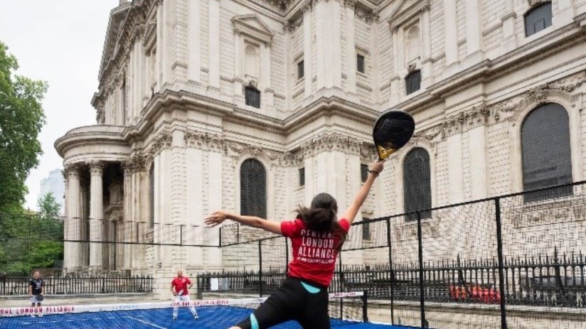 Athlete playing padel near St Pauls Cathedral Churchyard, showcasing urban sports integration in historic London settings.