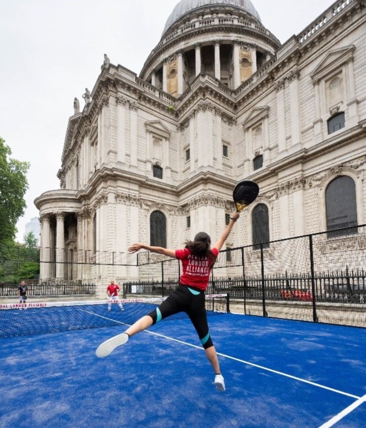 Athlete playing padel near St Pauls Cathedral Churchyard, showcasing urban sports integration in historic London settings.