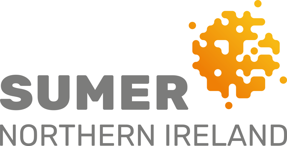 Scenic view of Northern Ireland countryside under summer sun, highlighting lush green landscapes and clear blue skies