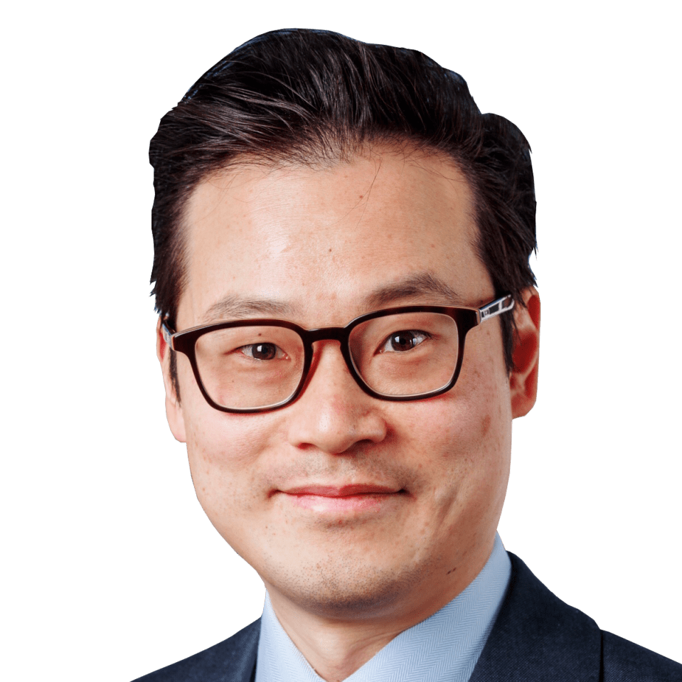 Stephen Yiu discussing Blue Whale investment strategies, featuring charts and graphs in a business meeting setting.