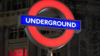London Underground roundel sign at a station, symbolizing Transport for Londons iconic public transit network
