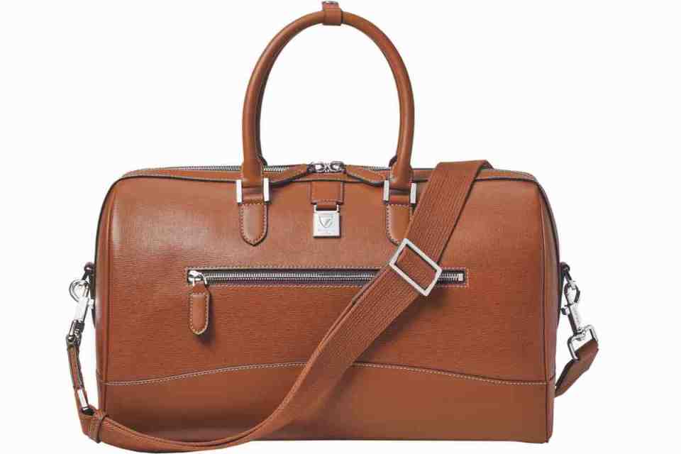 Aspinal leather product showcase with elegant design, highlighting craftsmanship and premium quality in business news context